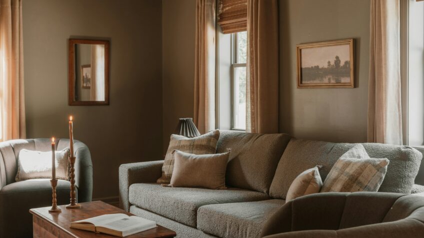 Cozy living room with sofa and armchair styled for a fall home refresh