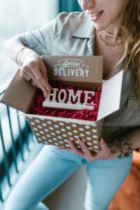 Woman opening a polka dot subscription box labeled Special Delivery